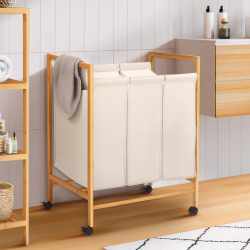 15142 - Cesto per la biancheria in bambù a 3 scomparti Panier à linge 3 compartiments en bambou RITA tissu écru avec roulettes