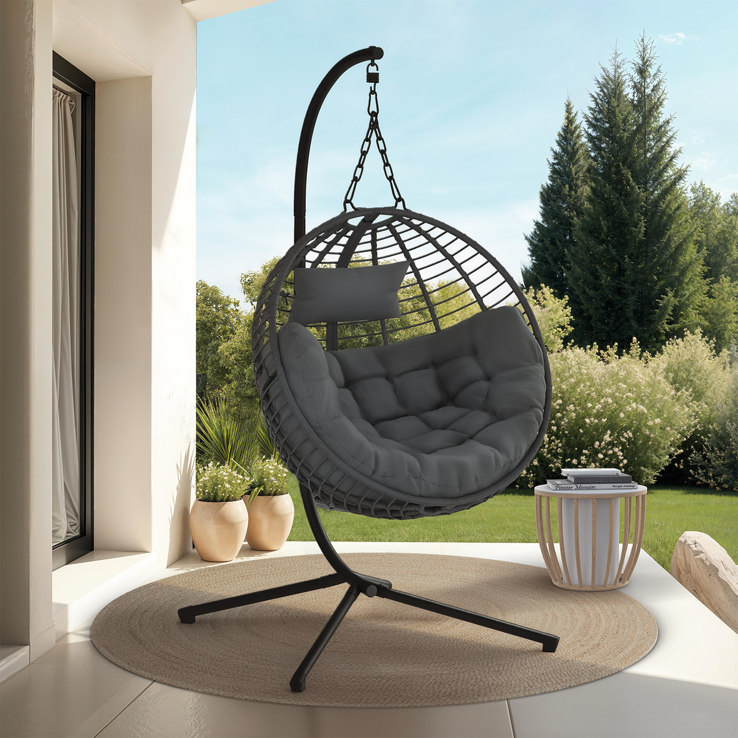 Fauteuil rond suspendu ajouré effet rotin gris avec coussin gris