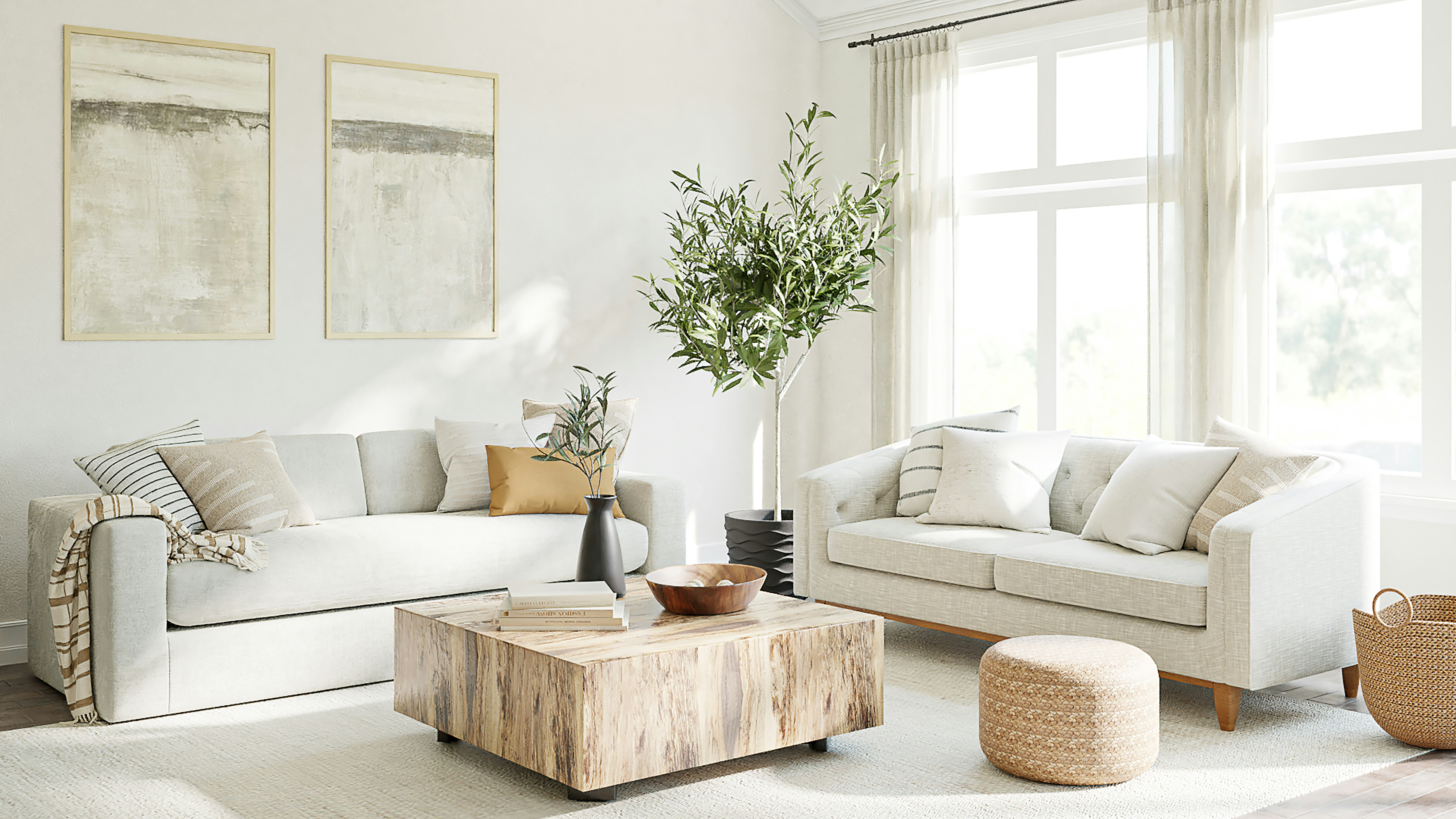 Salon moderne et lumineux aménagé avec un canapé confortable, un fauteuil design et une table basse